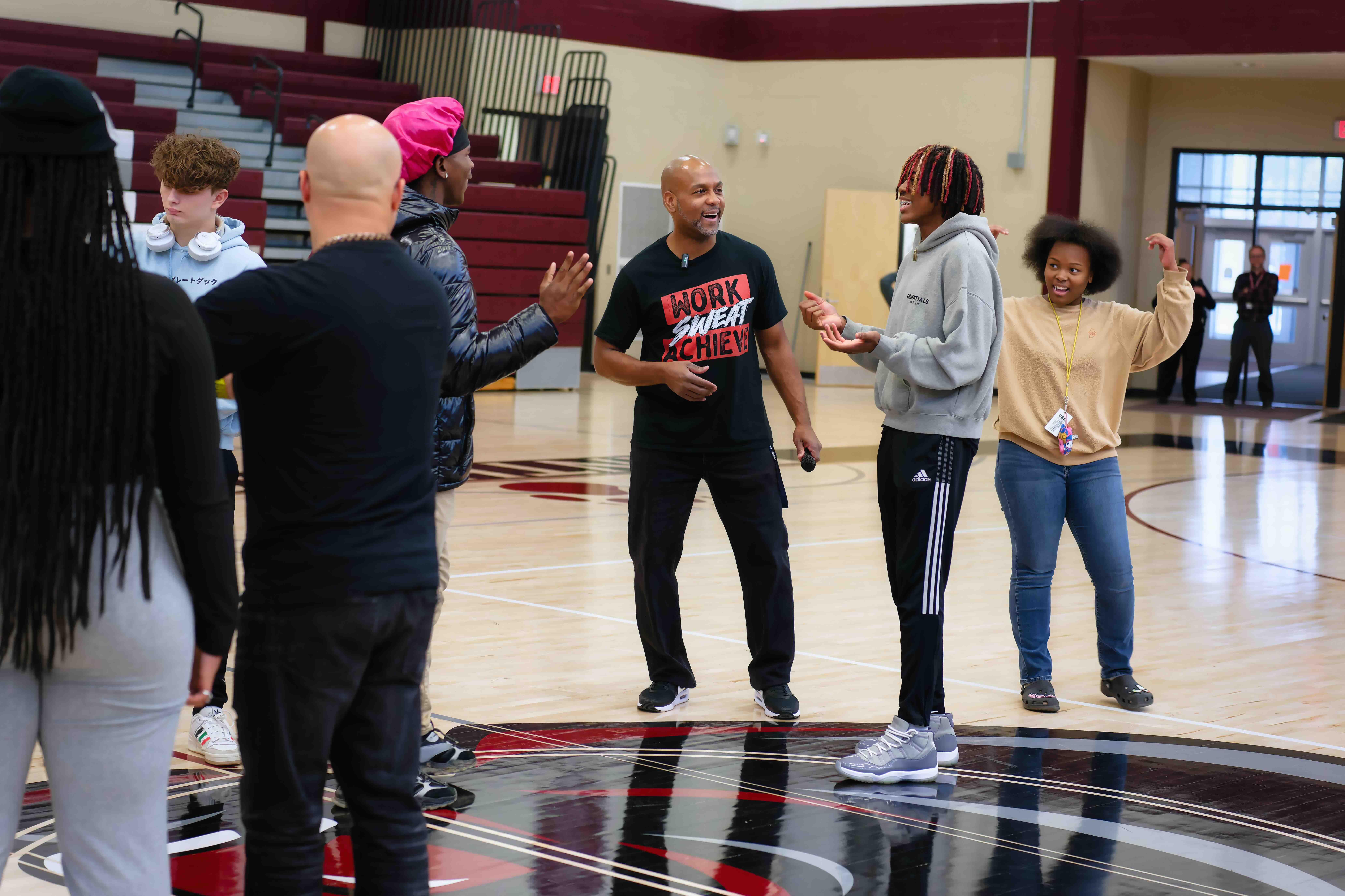 Coach Pete speaking to students