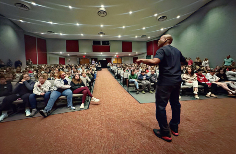 Coach Pete speaking to a live audience